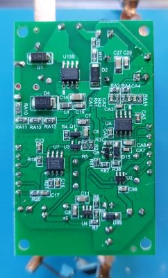 Image of a green circuit board with various electronic components.