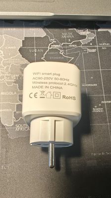 Tuya EU20A Wi-Fi Smart Plug View of a white Tuya EU20A Wi-Fi smart plug with technical specifications on a map background.