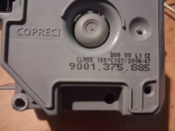 Zbliżenie szarej części z napisem COPRECI i numerem 9001.375.885 na plastikowej obudowie