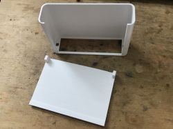 3D Printed Enclosure Prototype 3D printed enclosure parts on a workbench