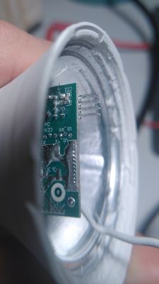 Close-up of a circuit board with visible electronic components and pins.