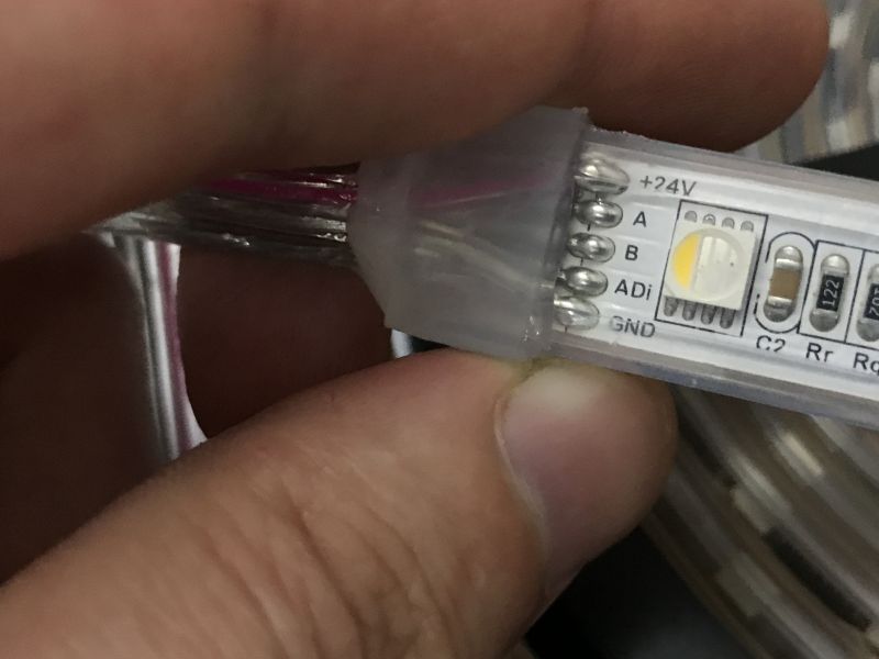 RGBW LED Strip with DMX512 Interface RGBW LED strip with labeled power and DMX512 communication lines.