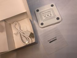 Contents of the Tuya Smart Gateway Box Box containing the Tuya Smart Gateway, USB cable, and user manual.
