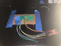 Electronic circuit connected to a USB to UART module with wires.
