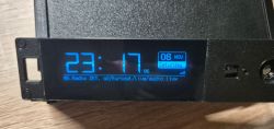 Display of a prototype internet radio with black casing and blue-lit interface