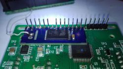 Image of a PCB with an SSD1305 display module mounted.