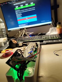 Open LSC Smart Connect power strip with visible wires against a computer screen background.
