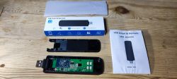 Disassembled USB Smart IR Remote with Components Disassembled USB Smart IR remote with PCB and packaging.