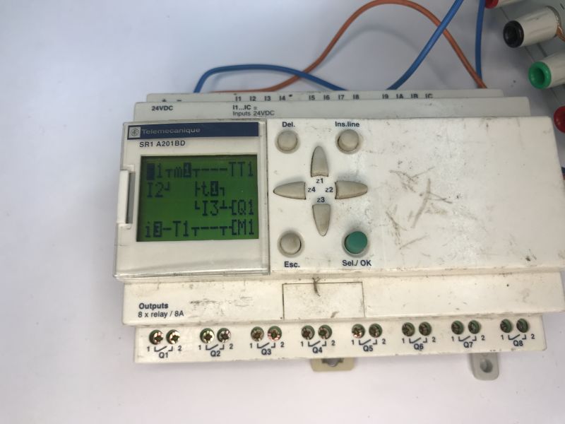 Telemecanique Zelio Logic SR1 A201BD controller with LCD screen and keypad, terminal blocks below