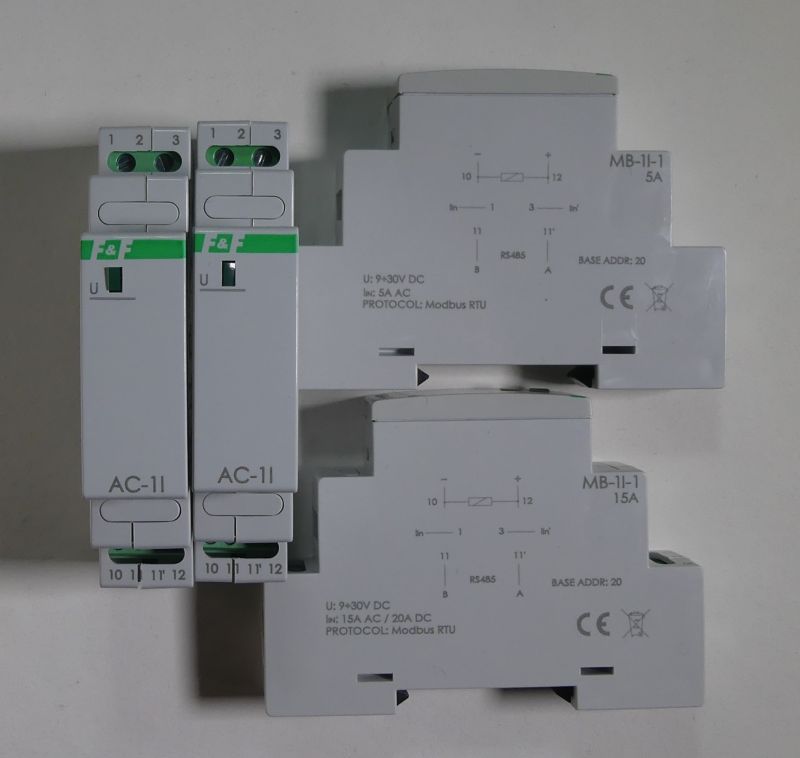 Zdjęcie przedstawia cztery moduły elektryczne do montażu na szynie DIN, oznaczone jako AC-11 oraz MB-II-1.