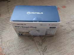 Antela WiFi Smart Plug Package Package of Antela WiFi Smart Plug, model F1s302-UK, on a carpet.