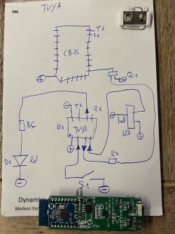 Hand-drawn electronic circuit diagram with a module on a piece of paper.