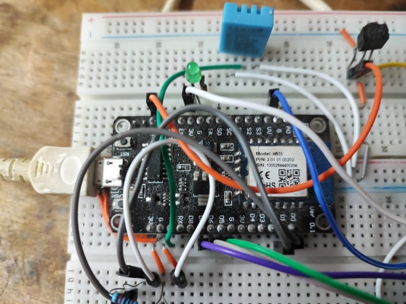 Microcontroller with connected wires on a breadboard