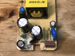 Interior of JKY0218-12V Power Supply Board PCB of power supply JKY0218-12V with electronic components.