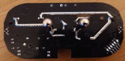 Close-up view of a circuit board with soldered components and traces.