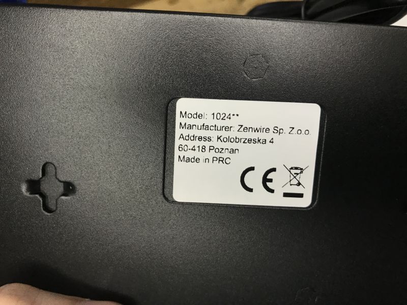 White label on black device with model and Zenwire manufacturer details, plus CE and crossed-out bin symbols