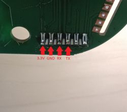 Circuit Board with Pin Labels Close-up of a circuit board with labeled pins 3.3V, GND, RX, TX.