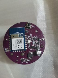 Round circuit board with various electronic components, including a CB3S module.