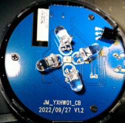 Close-up of a circuit board with LEDs and technical markings.