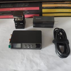 DP100 power supply, MHP30 station, Thinkplus charger and USB cable on white background