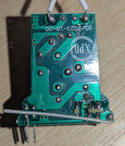 Green Printed Circuit Board with Trace Markings Close-up of a green printed circuit board with visible traces and solder points.