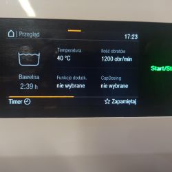 Wyświetlacz pralki pokazujący szczegóły programu prania bawełny.