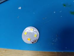 LED Module on Blue Background View of an LED module on a blue background.