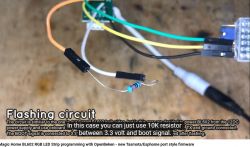 Electrical circuit with multicolored wires and a 10k resistor on a background.