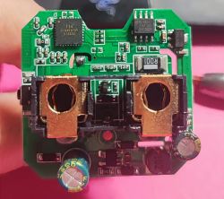 Circuit Board of QNCX Smart Plug Close-up of a circuit board of a smart plug with integrated circuits and electronic components.