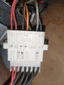 Close-up of an electrical connector with several colorful wires.