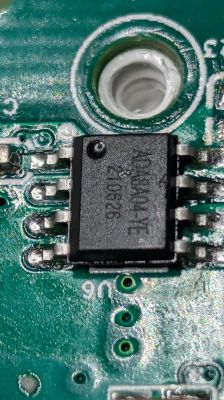 Close-up of an integrated circuit on the Tuya BW-CLT2 LED light's PCB board.
