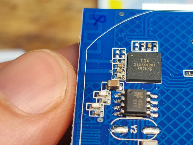 T34 Microchip on Circuit Board Close-up of a circuit board with T34 microchip
