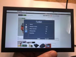 LCD EM713 display settings menu with image ratio and sharpness options visible