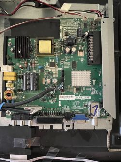 Mainboard of an LCD TV or monitor with various connectors and electronic components.