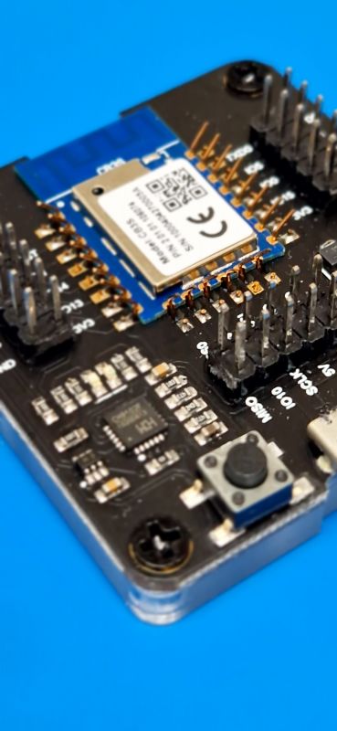 USB to UART Development Board with CB3S Module Development board with a CB3S module mounted on springs.