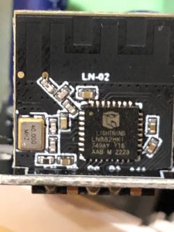 Close-up of a circuit board with a chip labeled LN82XHKI.