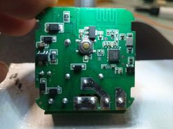 Close-up of a green circuit board with various electronic components.