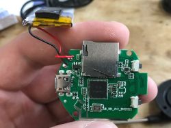 PCB with microSD slot, micro USB port, battery and flash chip labeled XF16