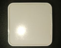 Rectangular device with a white casing on a black background.