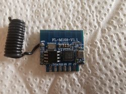 FL-M168-V1.1 radio module with coil antenna and integrated circuit chips