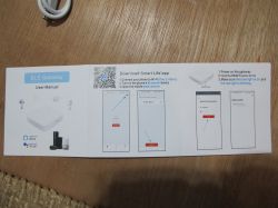 BLE Gateway User Manual BLE Gateway user manual with Smart Life app instructions on wooden background.