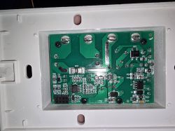Printed circuit board in a plastic casing with electronic components and screw terminals.