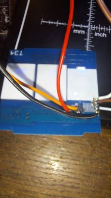 Close-up of the inner side of a Bingoelec touch switch with wires.