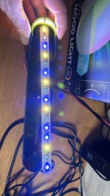 LEDs on a strip from a Chinese lens kit displaying colorful lights, with a Smart Mood Light box in the background.