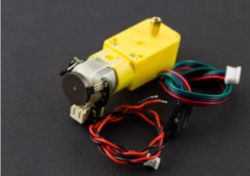 Motor with Encoder and Wires Yellow motor with encoder and wires on a black background.