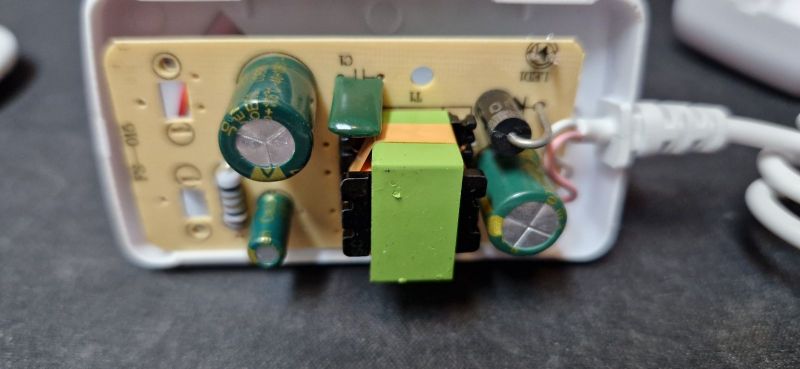Interior of LED power supply with electronic components.