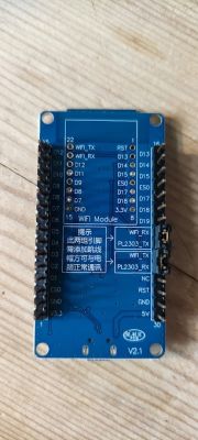 Blue printed circuit board with pin labels and side connectors.