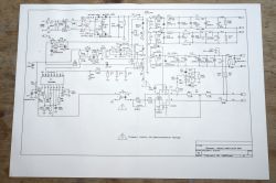 Printed electronic schematic diagram lying on a wooden table