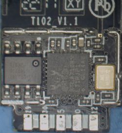 Close-up of an electronic module labeled T102 V1.1 with various components.
