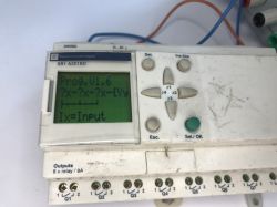 The interior of an old Schneider Electric SR1 A201BD programmable logic controller